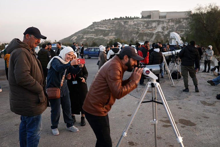 FILE: People gather to watch the Ramadan crescent moon marking the start of Ramadan at the foothills of Mount Qasioun, 17 Feb 2026 AP Photo/Ghaith Alsayed