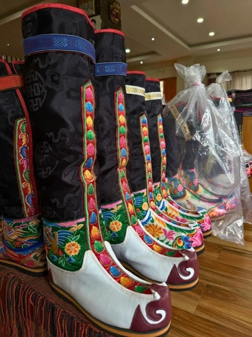 Bhutanese weavers create intricate geometric and symbolic designs. The patterns often incorporate Buddhist symbols that carry deep cultural and spiritual meaning. The designs are created entirely from memory on backstrap looms. Photo by Marybeth Bond