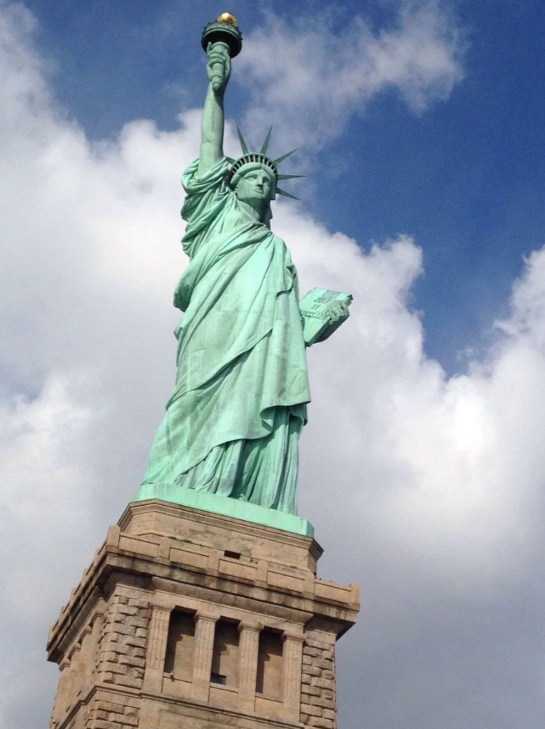 Reddit post about visiting the Statue of Liberty for the first time, described as a cliché travel experience