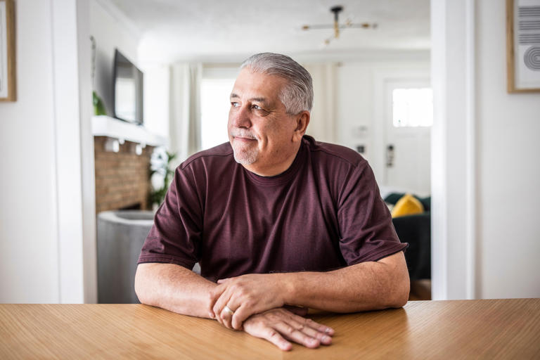 Portrait of senior couple in dining room (Photo: MoMo Productions via Getty Images)