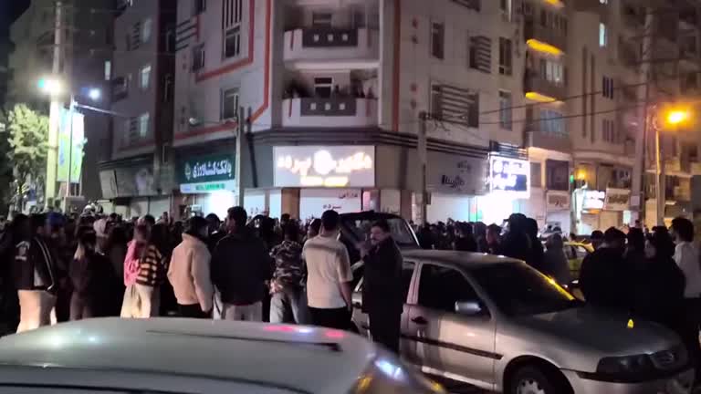 Iranians dance in the street after news of Khamenei