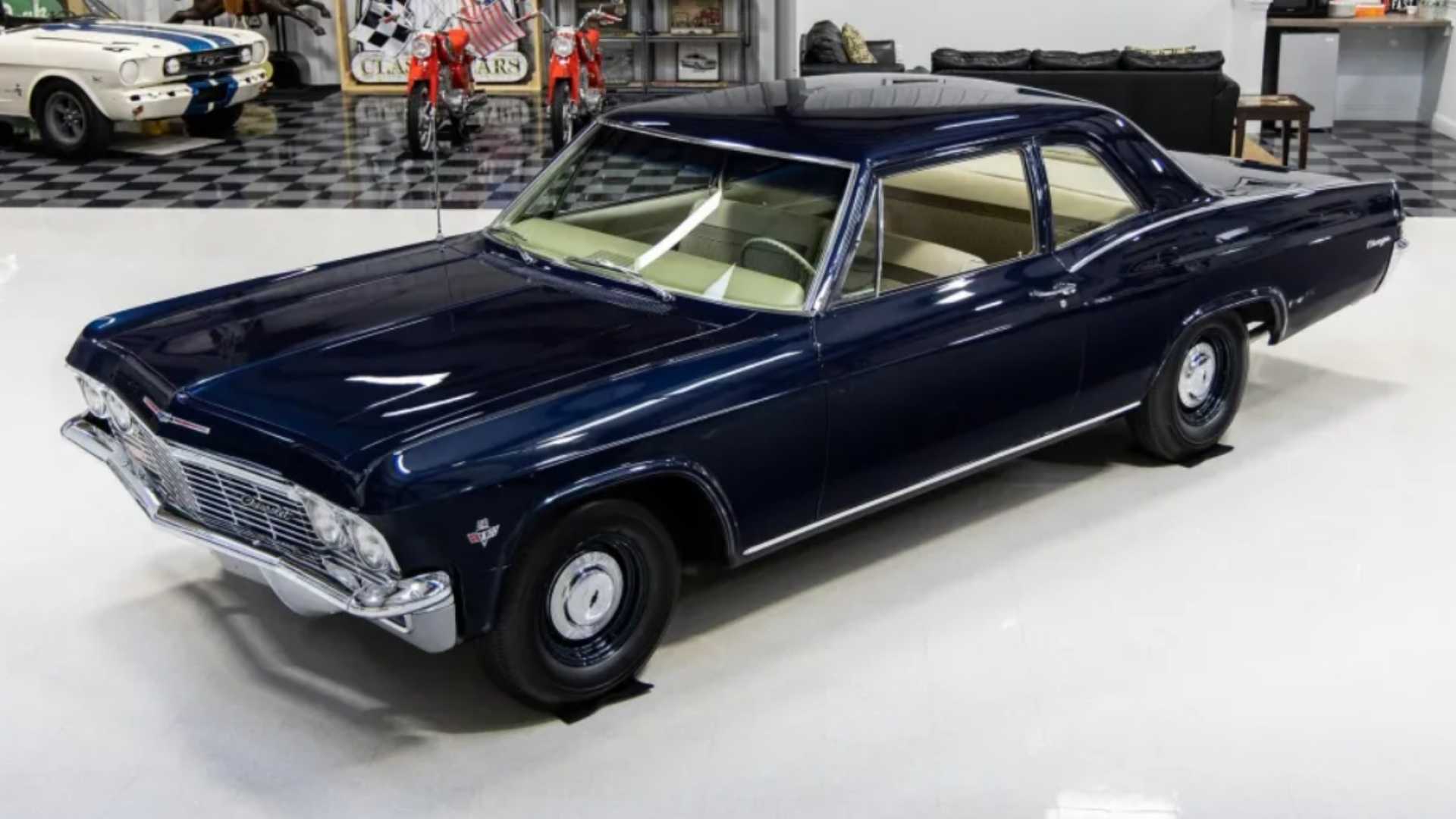 1965 Chevrolet Biscayne Two-Door Sedan 409/400 4-Speed blue in a shop