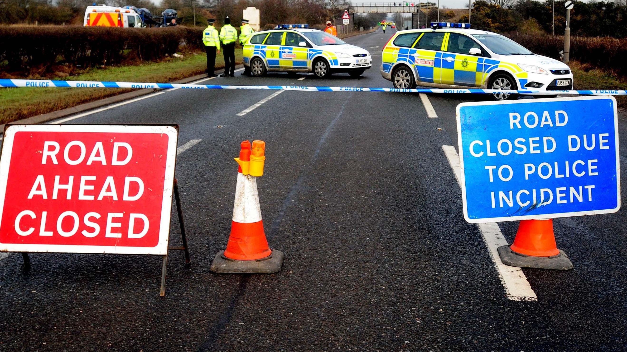 Woman dies in crash after car fleeing police drives on wrong side of road