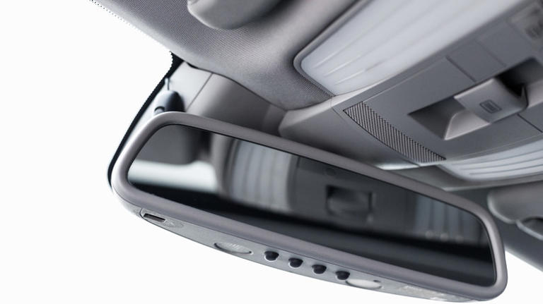 Your car's rear view mirror may have a button you're not using