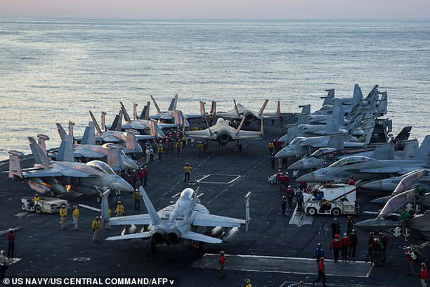 This US Navy handout photo released by US Central Command public affairs shows US sailors as they taxi aircraft to a staging point on the flight deck of Nimitz-class aircraft carrier USS Abraham Lincoln (CVN 72) in support of Operation Epic Fury, at an undisclosed location on&nbsp;