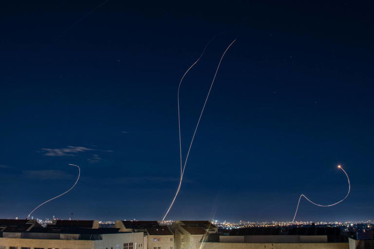 An Israeli air defence system intercepts a ballistic missile barrage over Tel Aviv launched from Iran on Sunday. Photo: Sopa Images/Zuma Press Wire/dpa