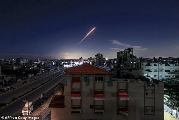 A missile launched from Iran is pictured in the sky from the Bureij camp for Palestinian refugees in the central Gaza Strip on March 1