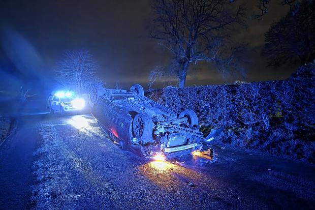 Driver arrested after 'very lucky escape' as car flips onto roof