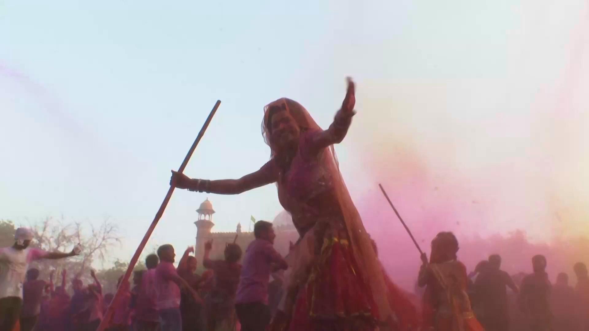 Spring in India: Colourful powder fills the air as an early Holi ...