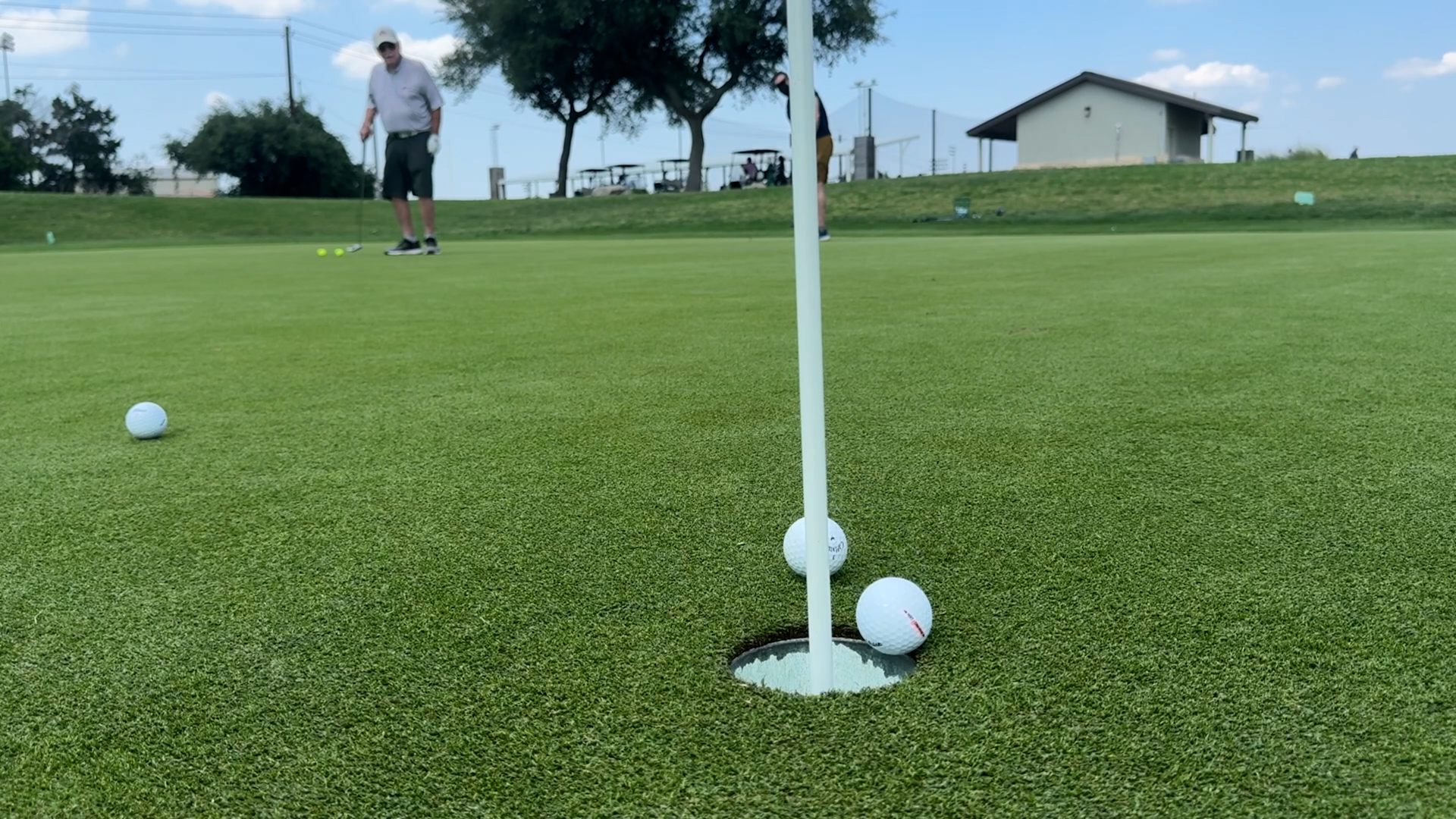 Farthest distance to putt two golf balls in a single stroke 12.23 ...