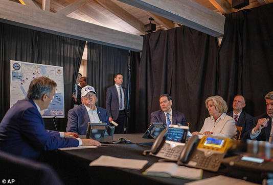 This photo provided by the White House which has been partially blurred, shows President Donald Trump talking with CIA Director John Ratcliffe, left, Secretary of State Marco Rubio, and White House chief of staff Susie Wiles at Mar-a-Lago in Palm Beach, Fla., during Operation Epic Fury on Saturday, Feb. 28, 2026