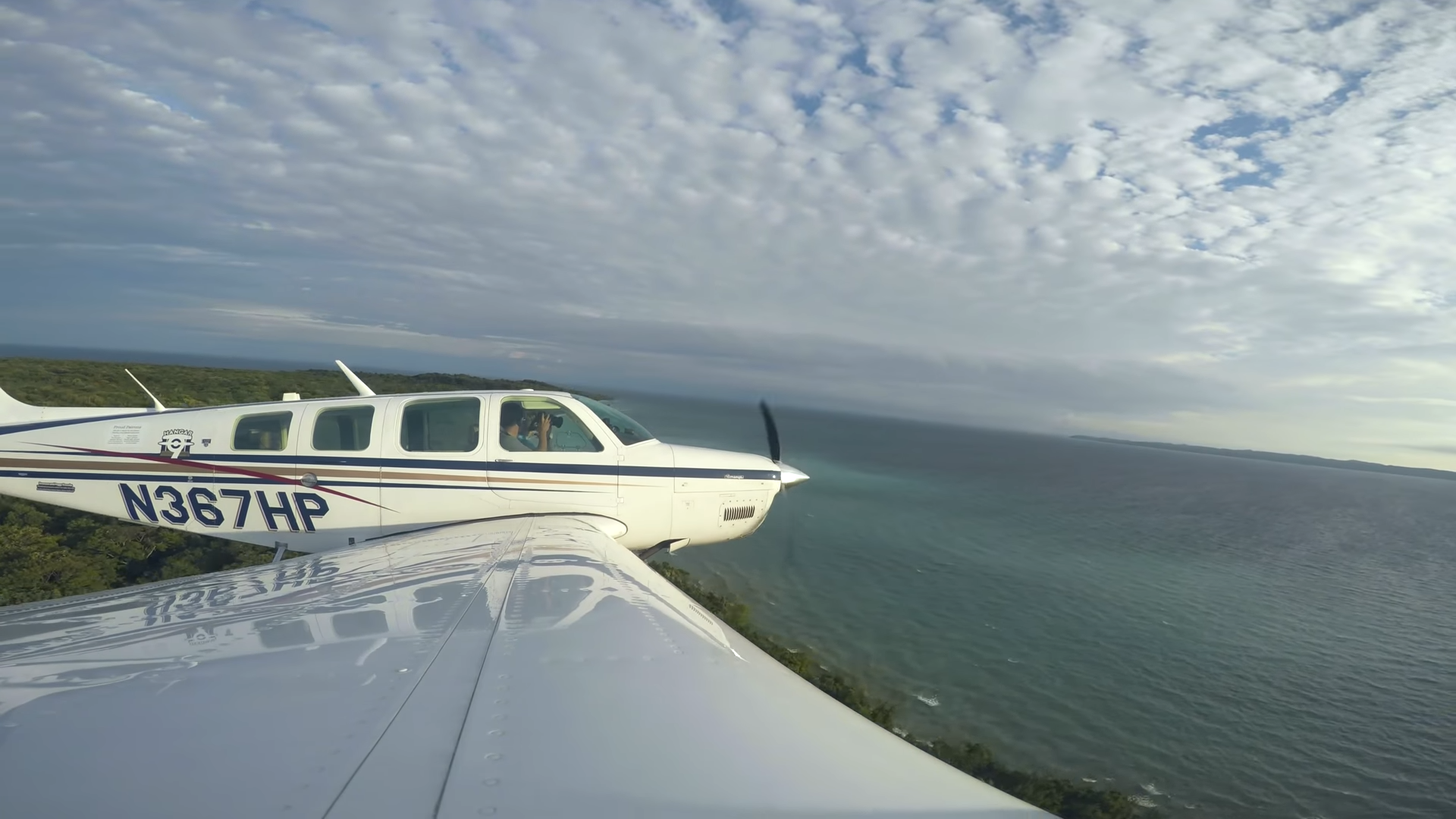 Watch a single engine plane thread between thunderstorms