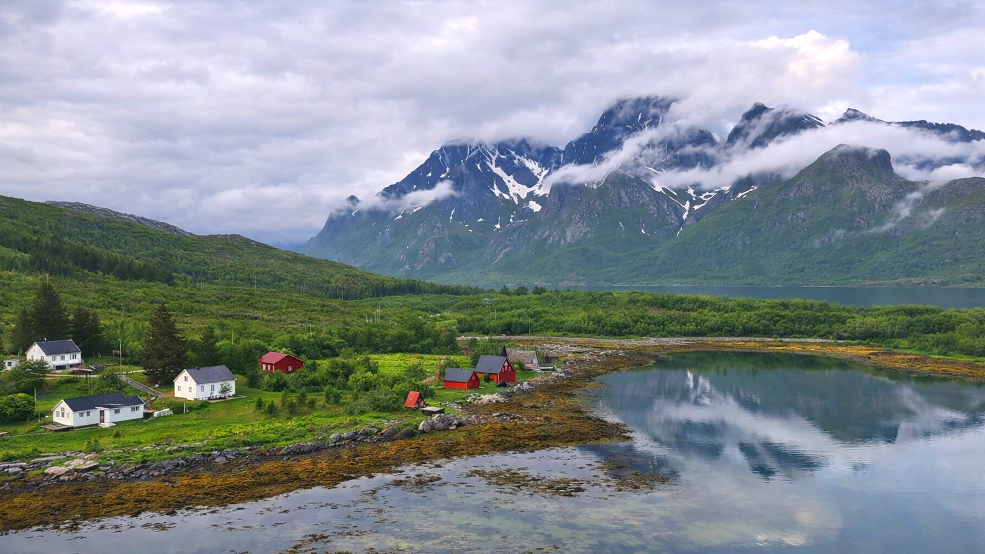 A quiet fjord village surrounded by dramatic Nordic mountains