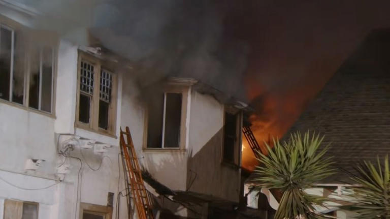 Terrifying moment woman jumps from 2nd-floor window as building erupts ...
