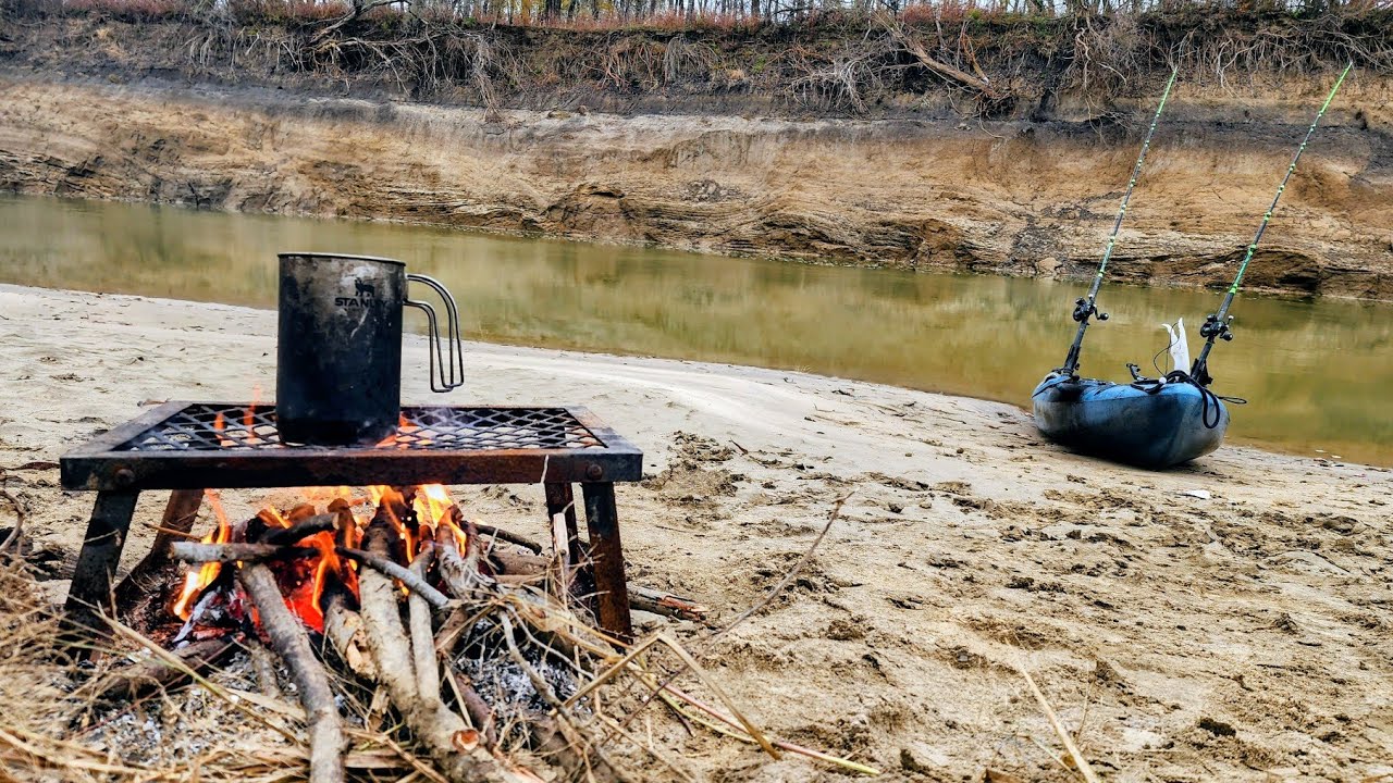 River fishing from a sandbar