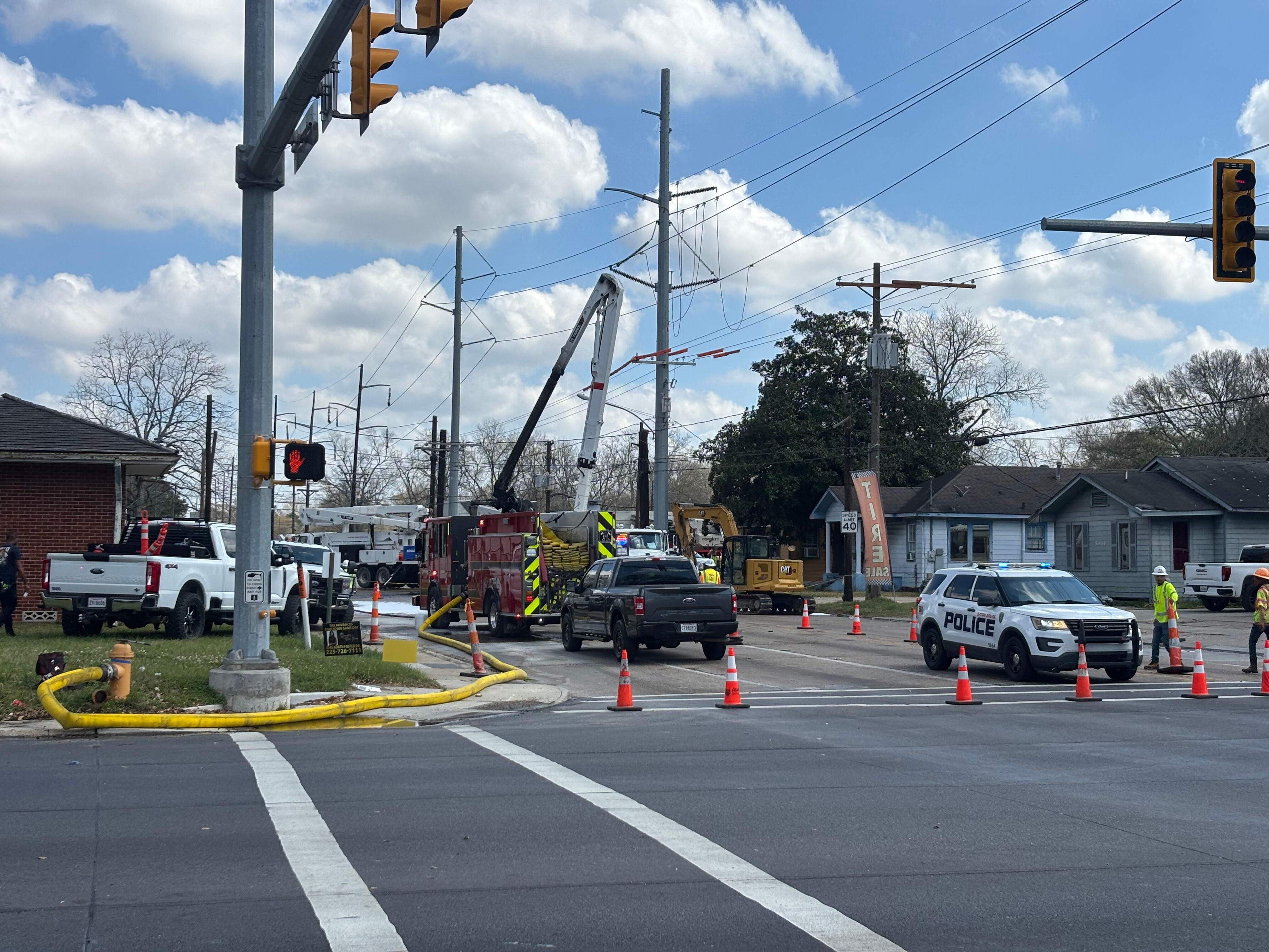 Person injured after falling from burning bucket truck, officials say