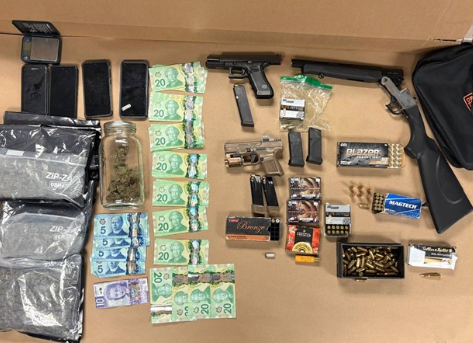 Toronto man faces 22 charges after guns, ammo, pot and cash seized by cops