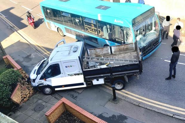 Driver suffers serious head injury after van and bus crash