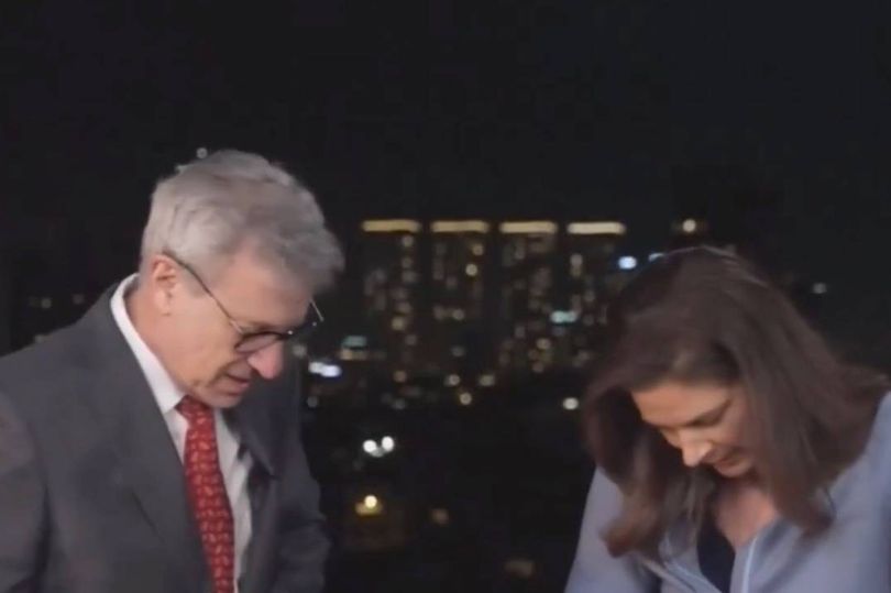 Chaos on CNN as anchor forced to take cover live on air as Tel Aviv air sirens sound<br>