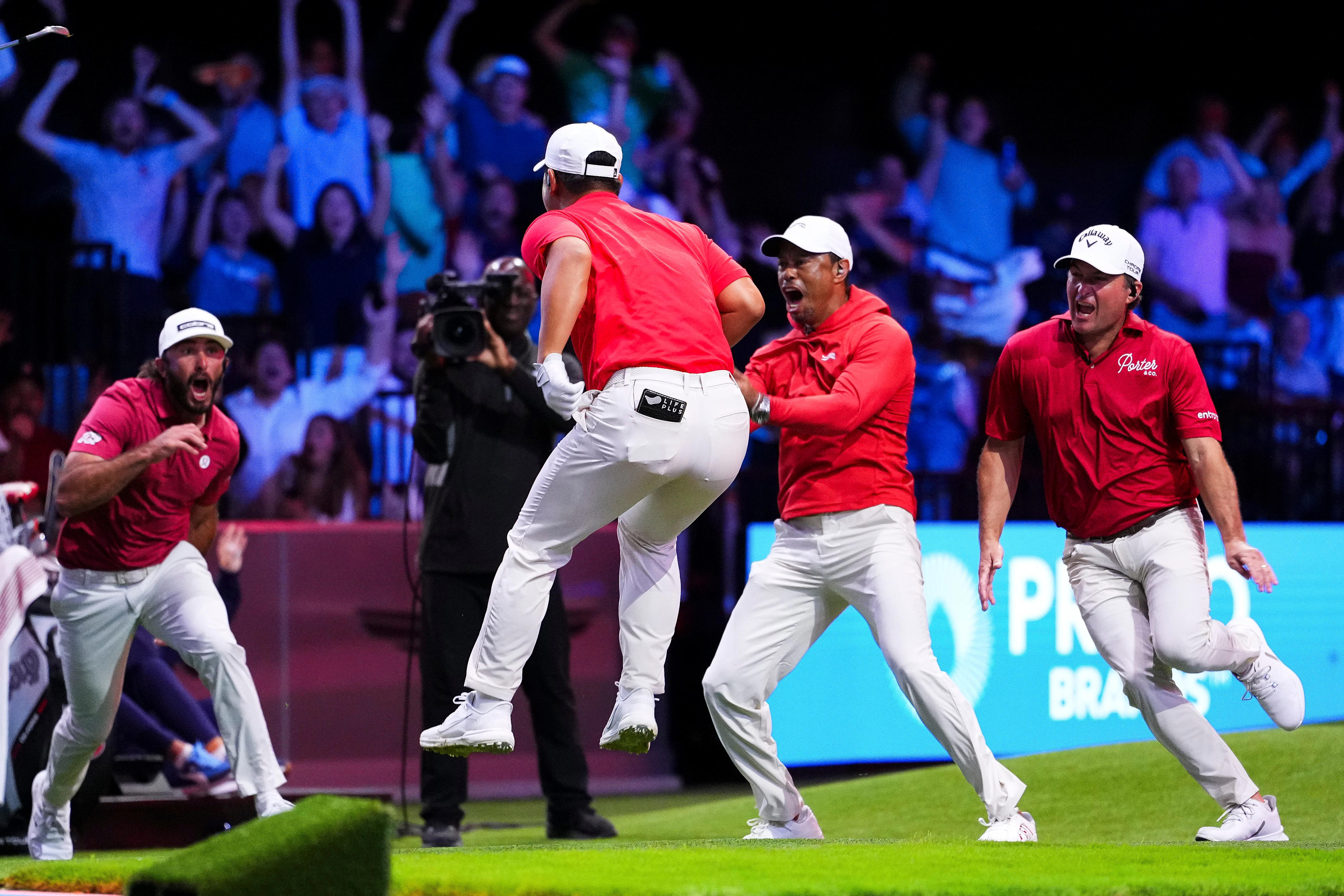 PALM BEACH GARDENS, FLORIDA - MARCH 03: Tom Kim of Jupiter Links GC celebrates with teammates after hitting a hole-in-one on the 14th hole during a match against The Bay Golf Club at SoFi Center on March 03, 2026 in Palm Beach Gardens, Florida. (Photo by Rich Storry/TGL/TGL Golf via Getty Images)