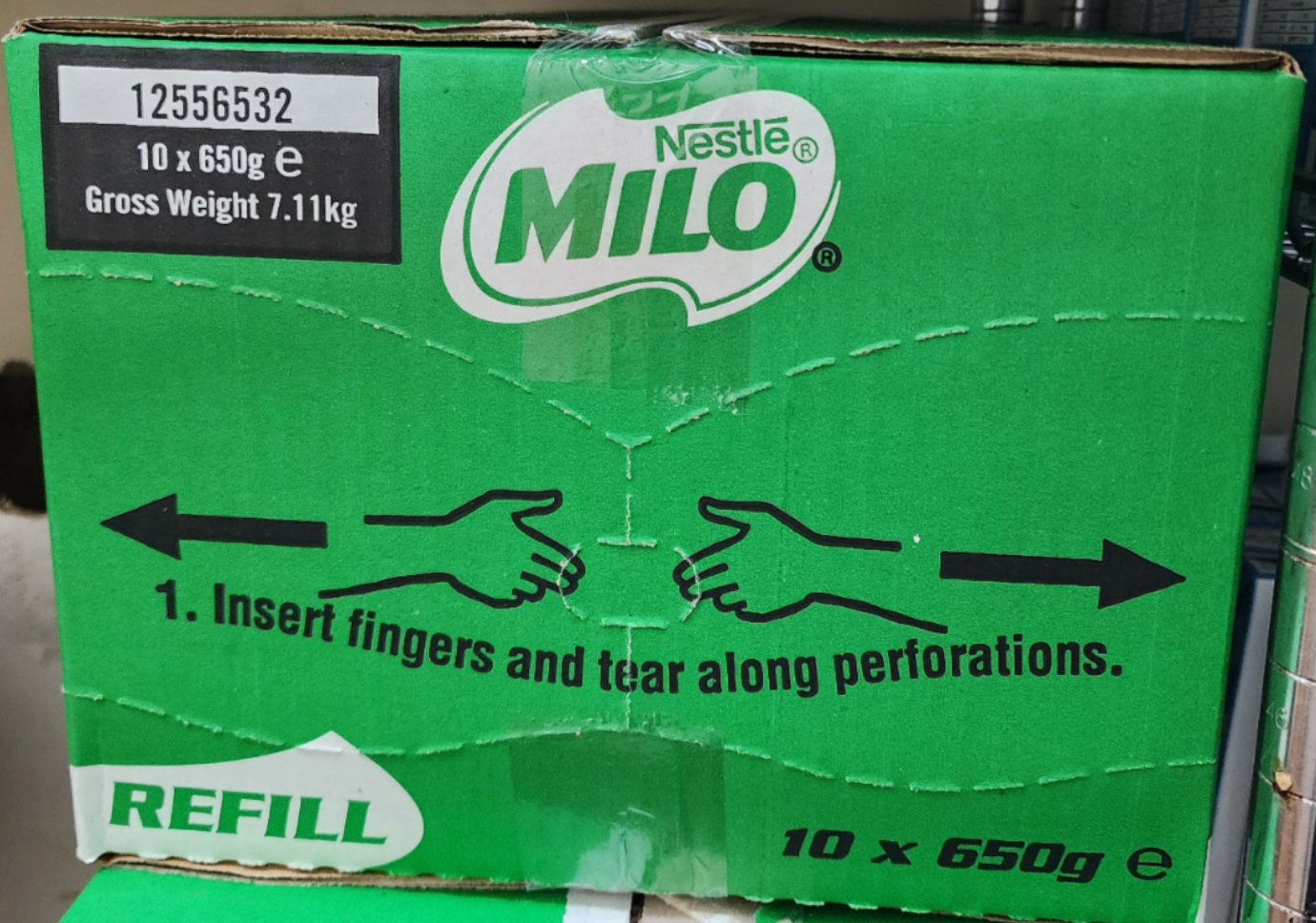 Green Nestlé Milo box showing instructions: "Insert fingers and tear along perforations."