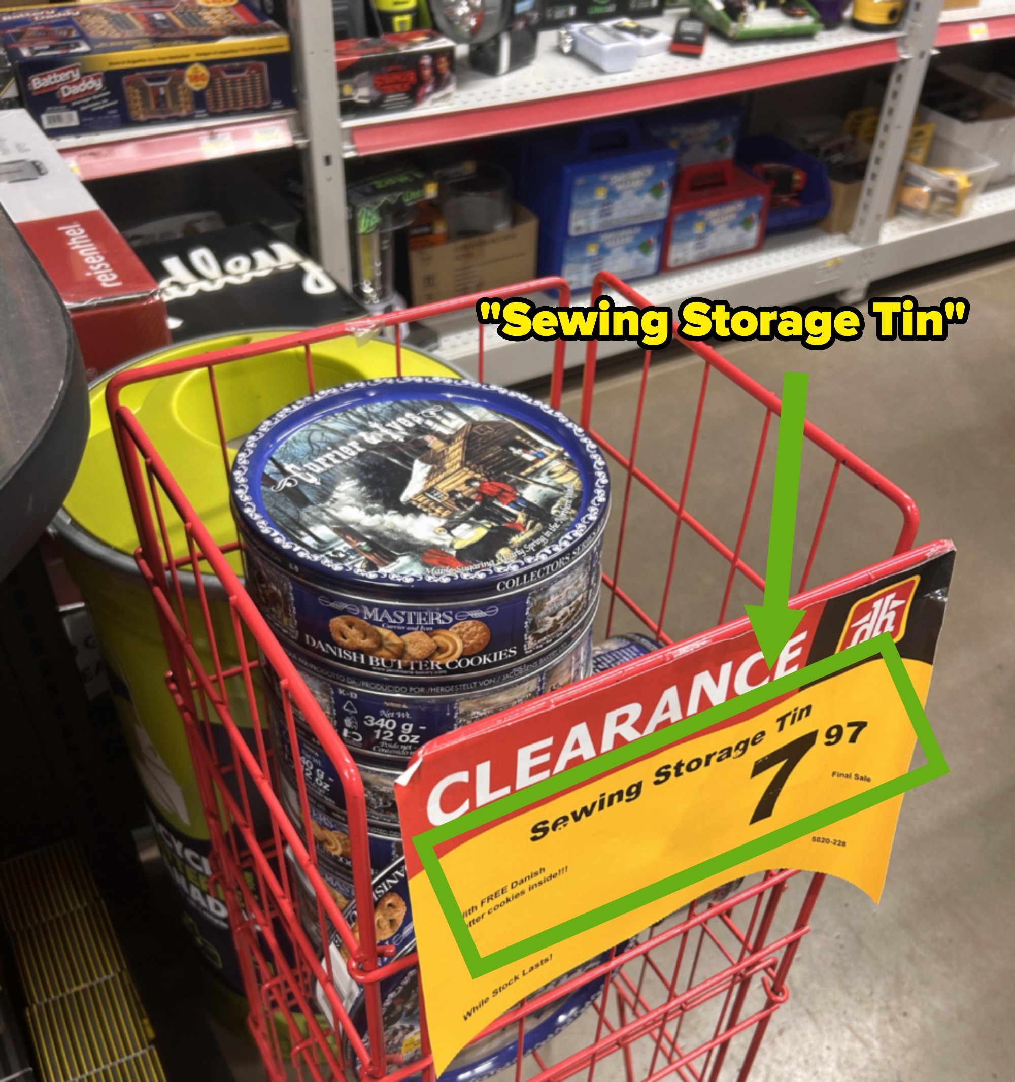 Clearance sale of Danish cookie tins used for sewing storage, priced at $7.97, in a store aisle