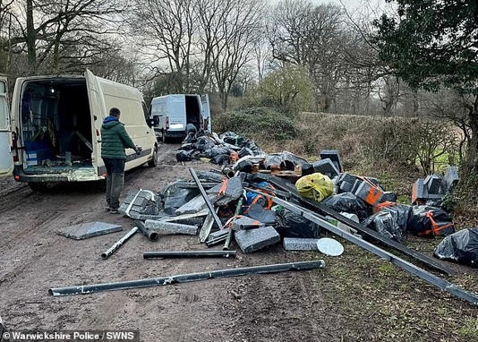 Two fly-tippers were caught dumping rubbish from two white vans on a country lane near Meriden in the West Midlands in 2024