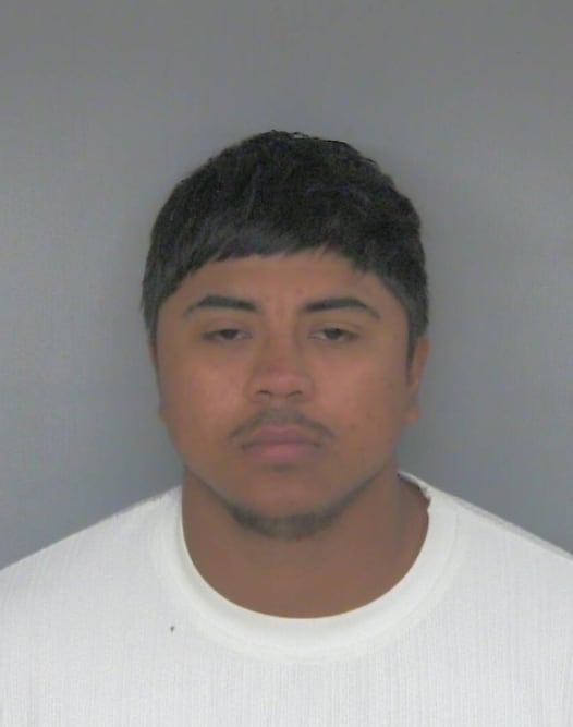 Man arrested after guns, drugs found during traffic stop
