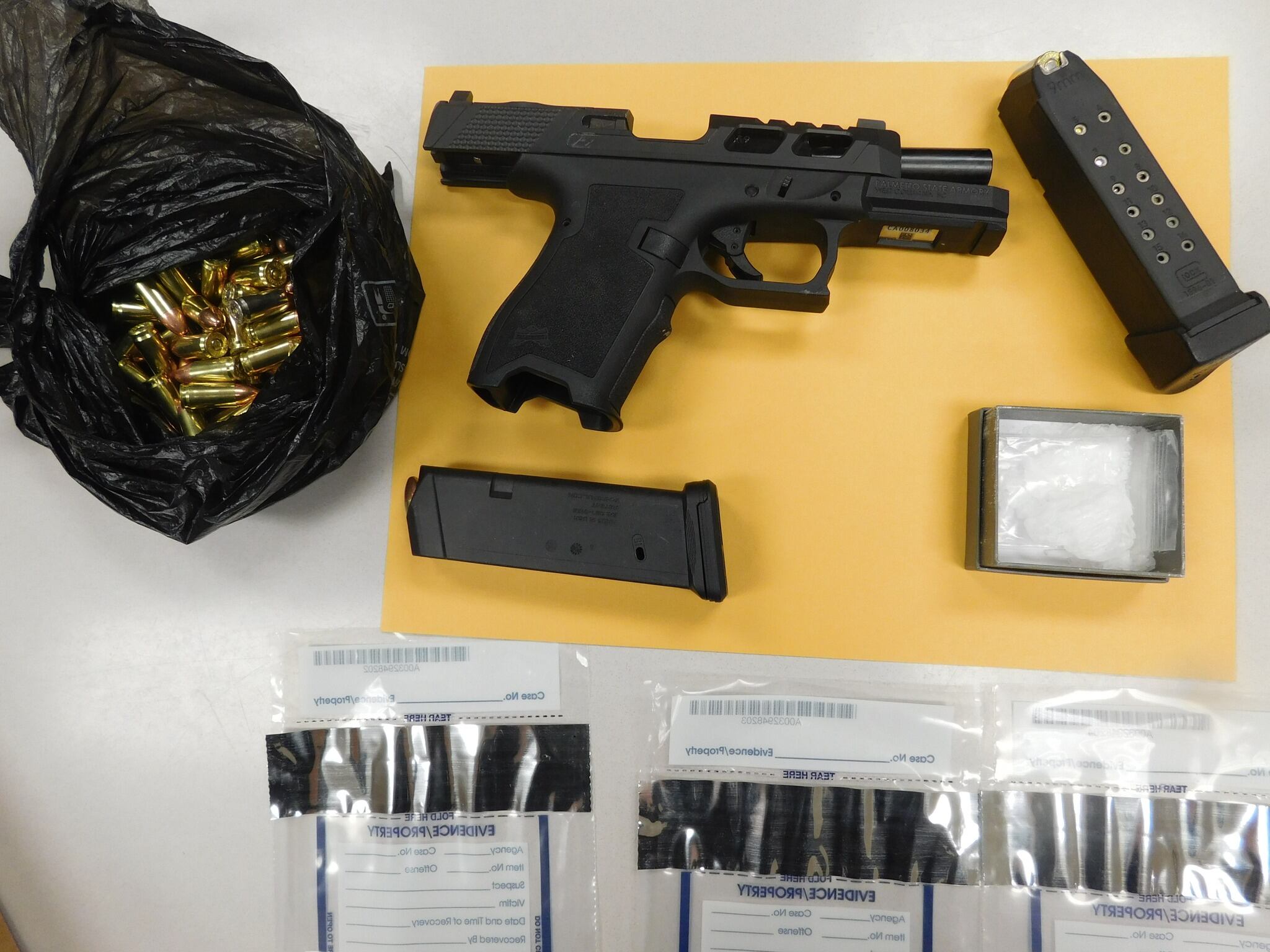 Man arrested after guns, drugs found during traffic stop