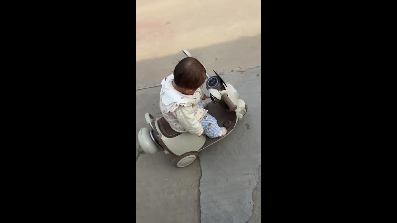Baby learns to ride balance bike in Henan, China