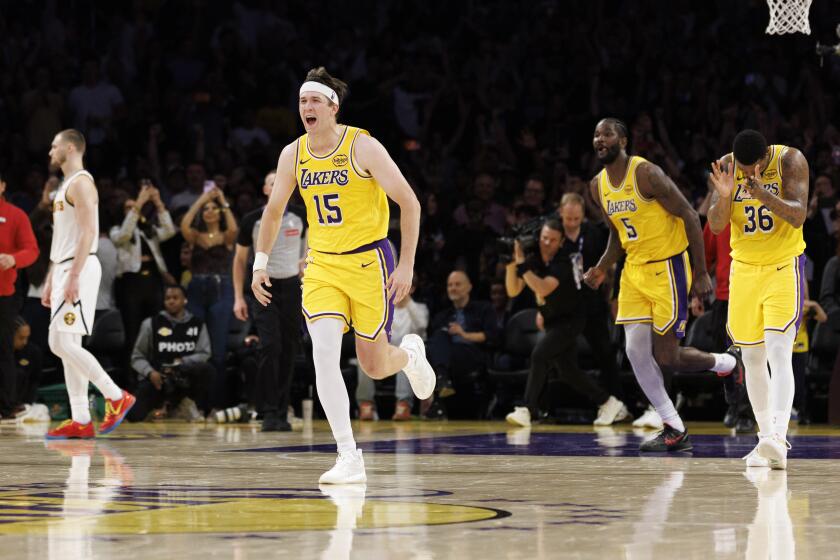 Luka Doncic, Austin Reaves lift Lakers to thrilling overtime win over ...