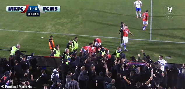 Footy player injured in crowd surge chaos that saw a fence collapse on ...