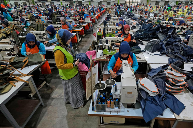 Workers at a garment factory in Bandung, West Java, Indonesia. About 43 per cent of Indonesian workers have experienced burnout at work, according to a survey by Jobstreet by SEEK. Photo: AP