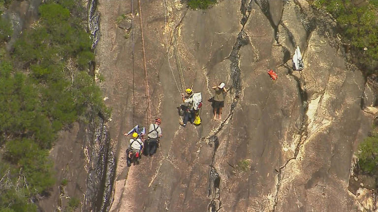 One teenager is dead and another is fighting for life after the pair fell while hiking in the Glasshouse Mountains on Queensland's Sunshine Coast.