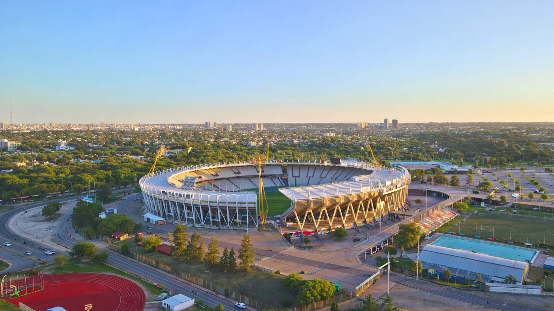 Golden hour over a modern sports arena