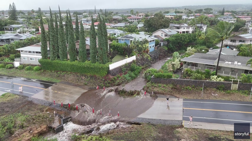 Drone footage captures water gushing over road during Hawaii flash flooding<br>