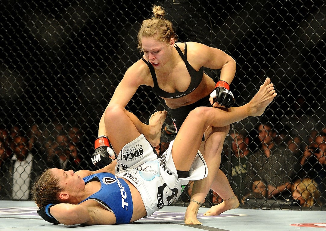 UFC legend, WWE star, SI swim model: Ronda Rousey’s fiercest moments