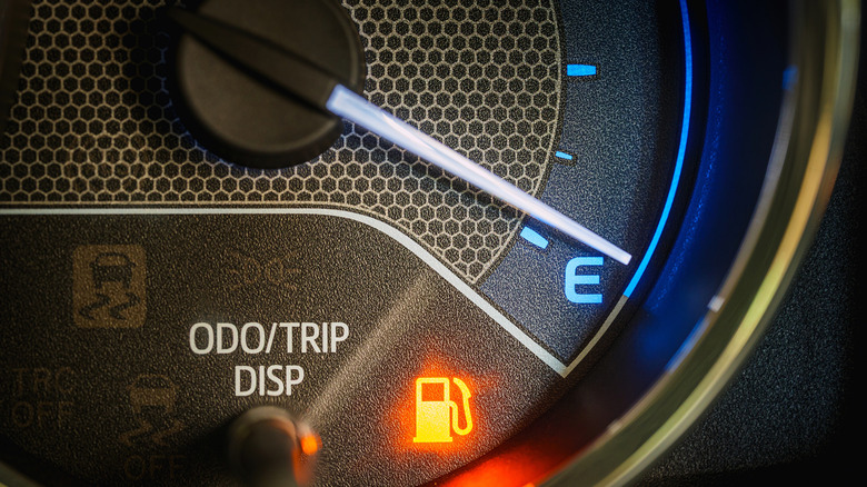 the low fuel light on the car dash is turned on
