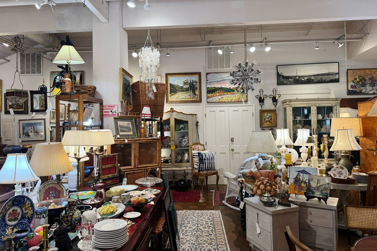 Interior of antique store with various vintage items furniture and decorative pieces displayed