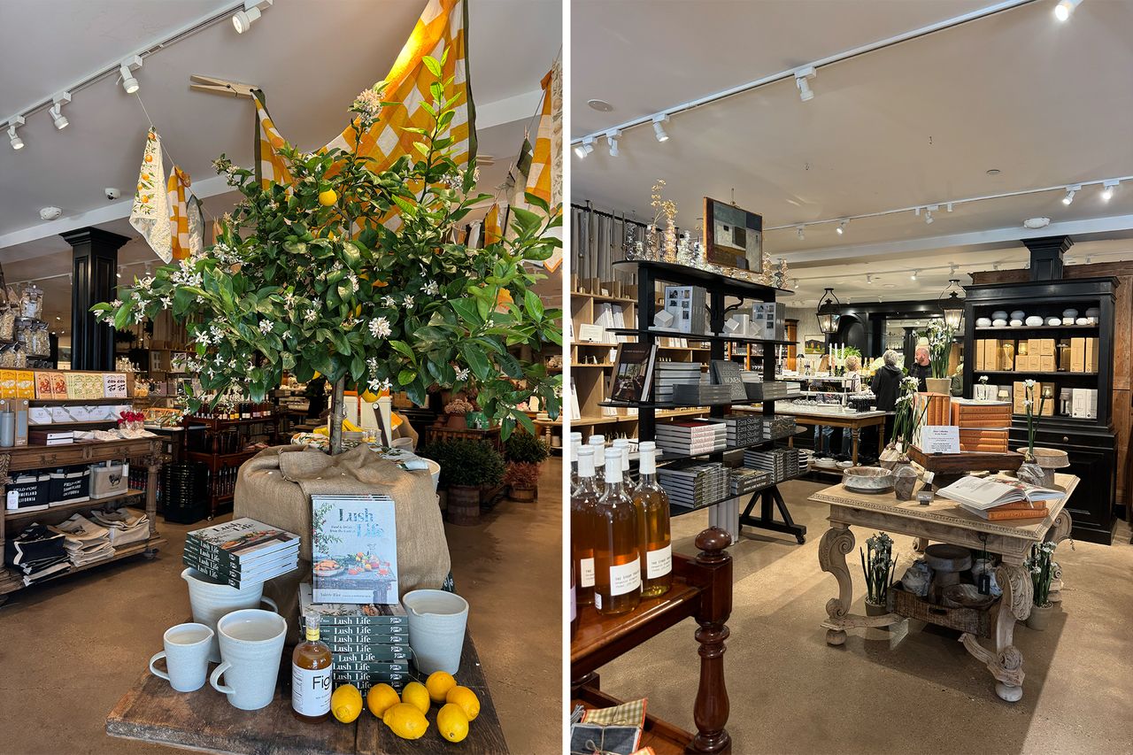Interior of a boutique store with various items displayed on tables and shelves