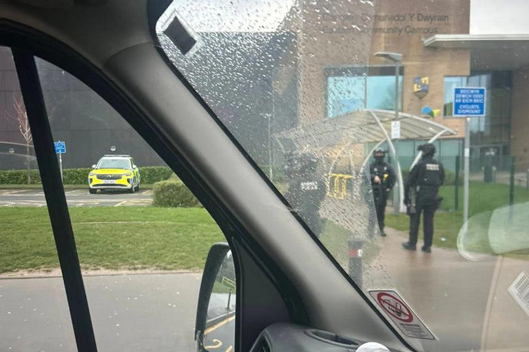 Armed police seen as two city schools forced to close