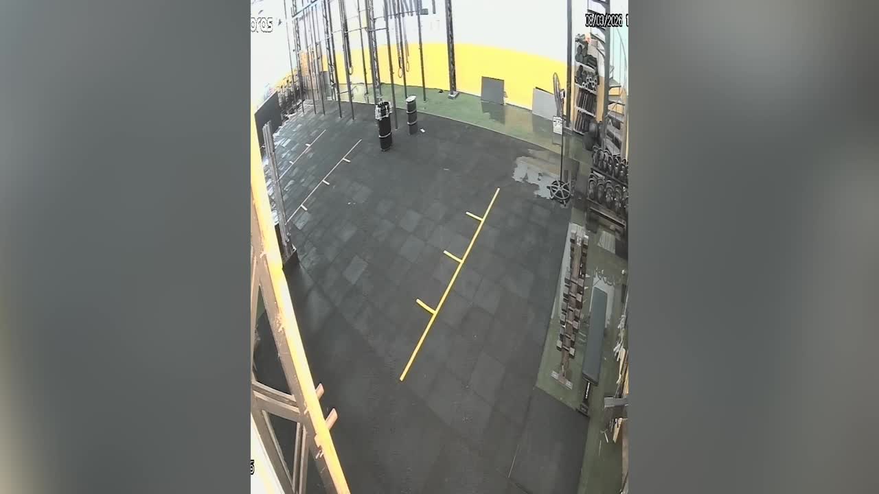 CCTV captures moment flash flood breaks through wall and destroys gym
