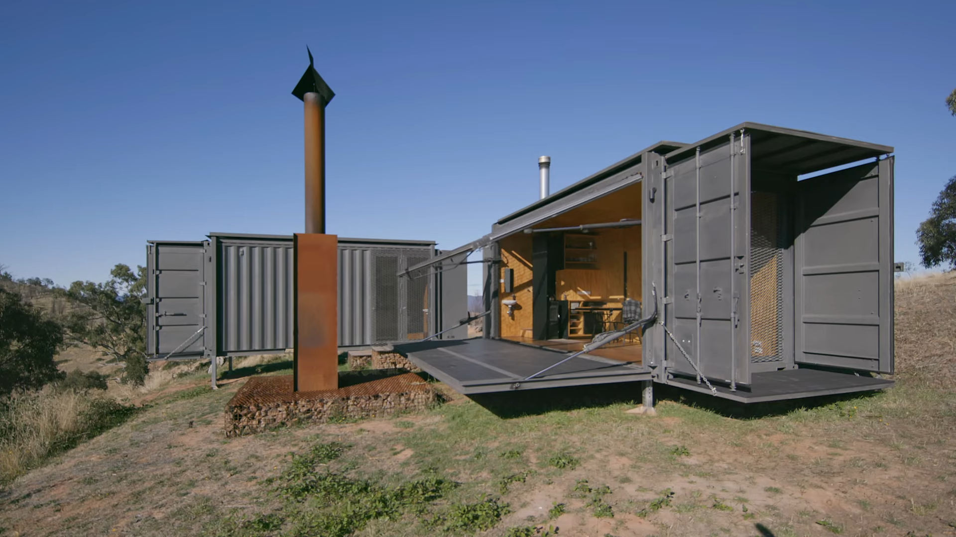 Watch how this 323 sqft shipping container became a comfortable tiny home