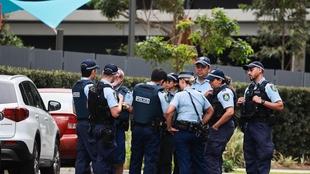 Woman threatened with gun in carpark: cops