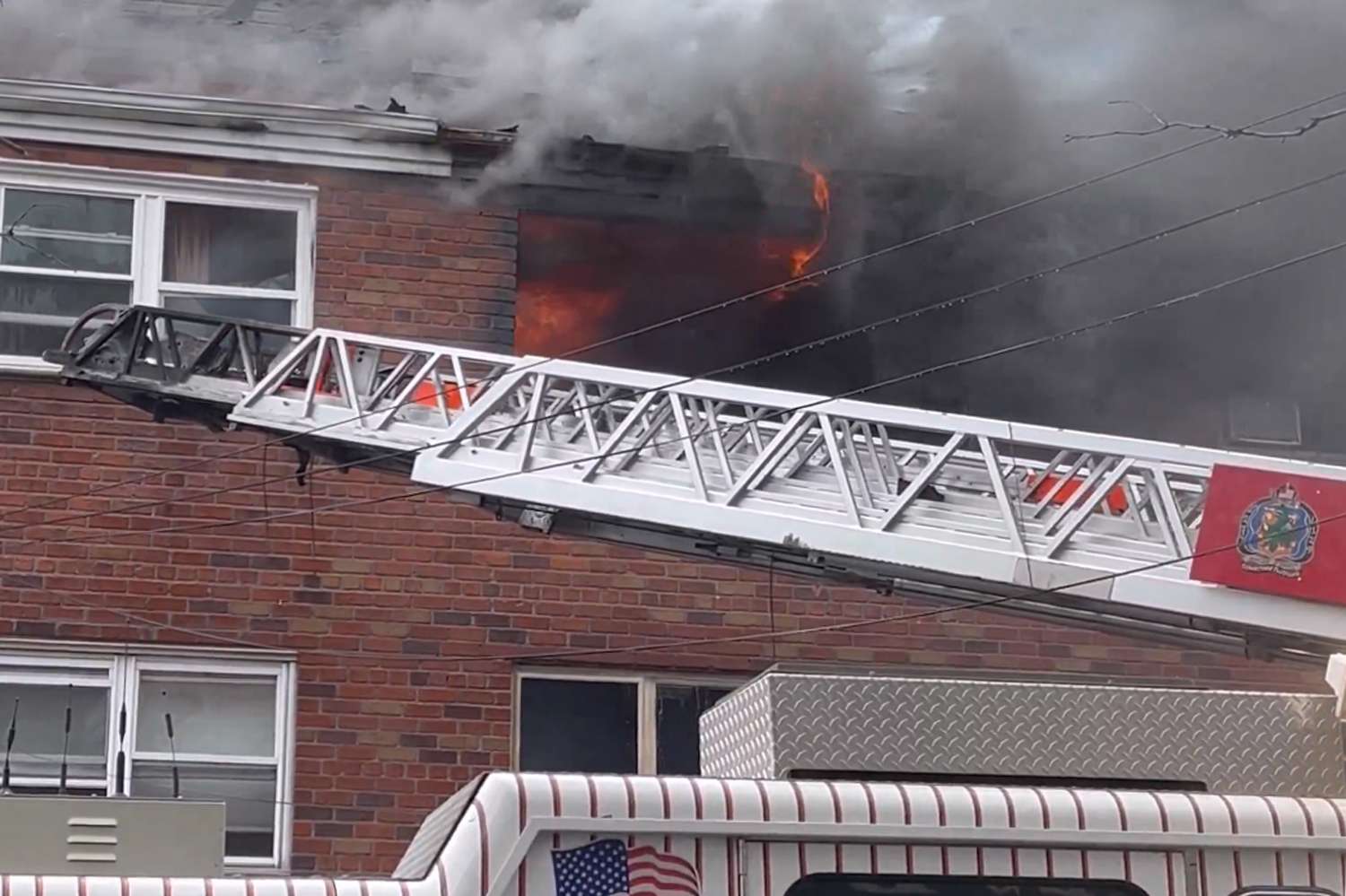 Child among 4 killed in fire that forced residents to jump from building