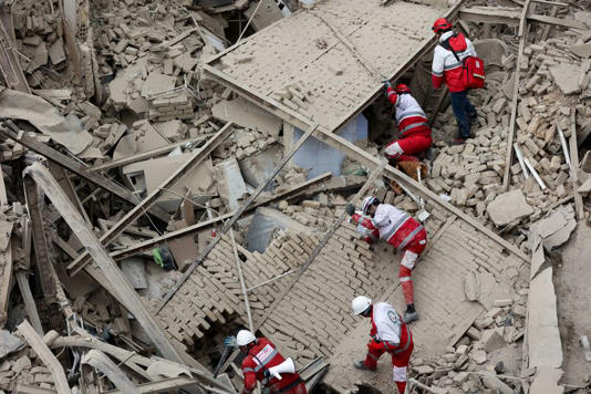 Emergency personnel work at the site of a strike on a residential building, amid the U.S.-Israeli conflict with Iran, in Tehran, Iran, March 16, 2026. Majid Asgaripour/WANA (West Asia News Agency) via REUTERS