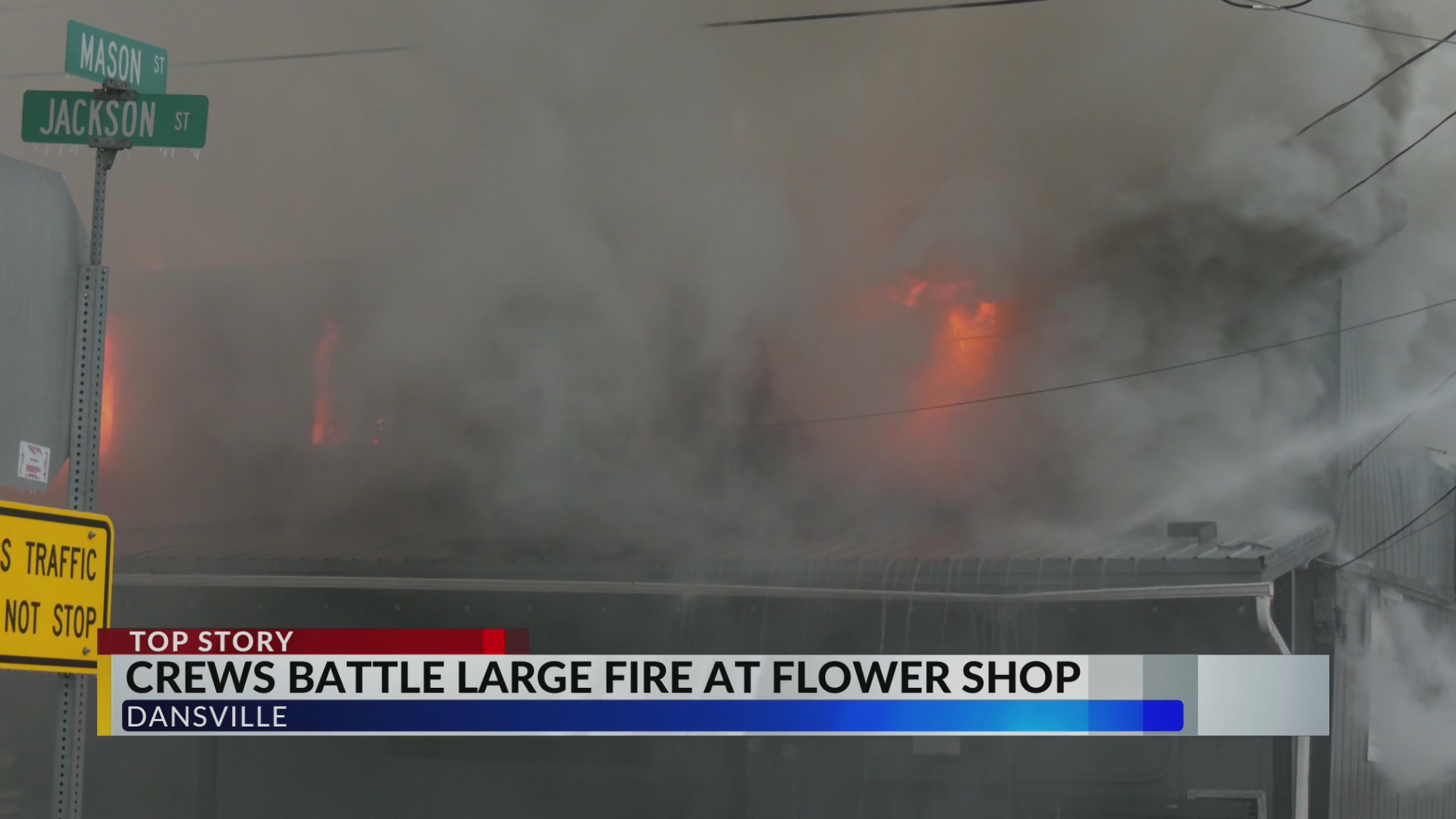 Crews battle large fire at flower shop