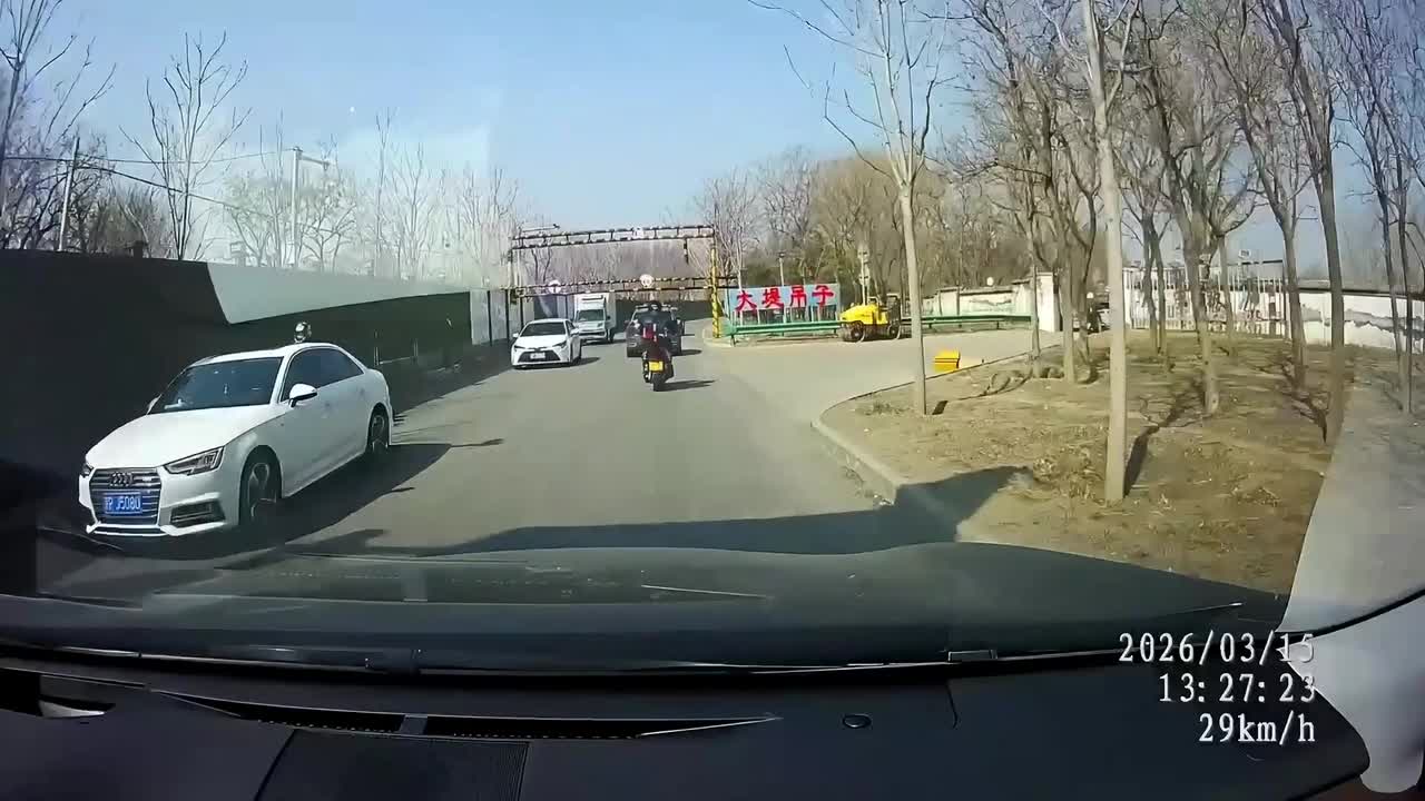Motorcyclist knocked off bike after truck crashes through height ...