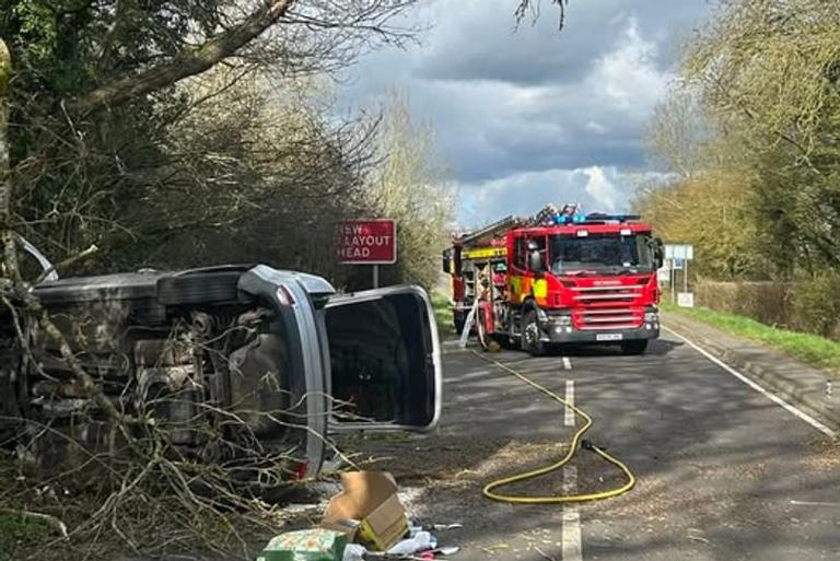 Crash causes fire and leaves car on side in Cambridgeshire village