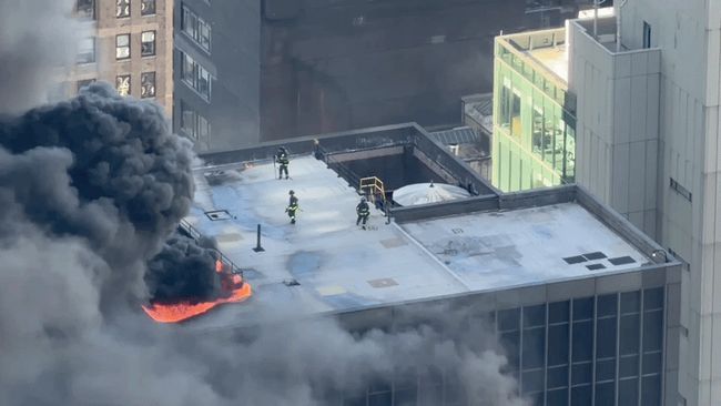 Flames leap from Manhattan high-rise fire